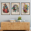 Laden Sie das Bild in den Galerie-Viewer, old dictionary style framed anatomy art print set of 3 design, including heart and rib cage anatomy, decorating a wall in a home
